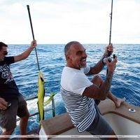 Christian Audigier catches a huge fish with his girlfriend Nathalie Sorensen | Picture 124256